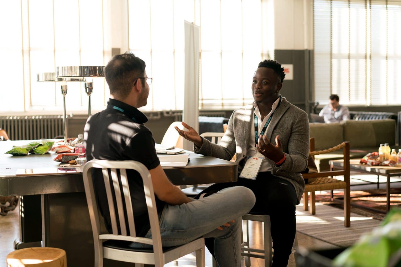 Two men in a business services marketing role play.